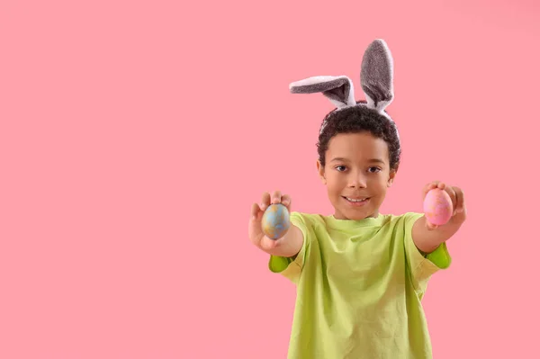 African American Little Boy Bunny Ears Easter Eggs Pink Background — Stok fotoğraf