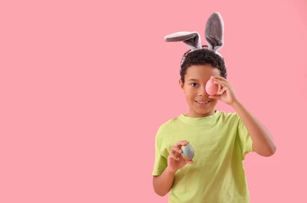 African American Little Boy Bunny Ears Easter Eggs Pink Background — Stok fotoğraf
