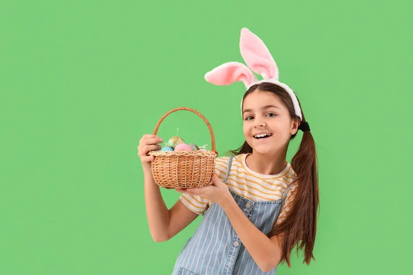 Little Girl Bunny Ears Basket Easter Eggs Green Background — Stock Fotó