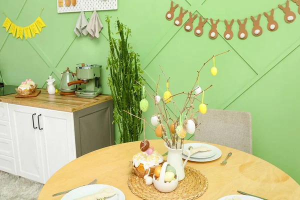 Interior of modern kitchen with table served for Easter celebration