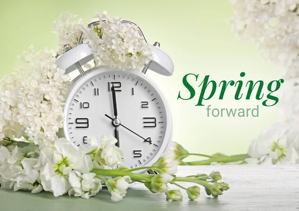 Alarm Clock White Flowers Green Background Spring Time — Stock Photo, Image