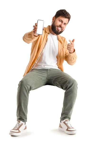 Young Bearded Man Pointing Mobile Phone White Background — Stock Photo, Image