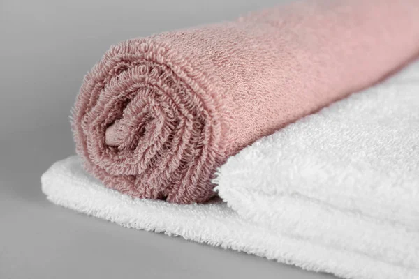 Cotton soft towels on grey background