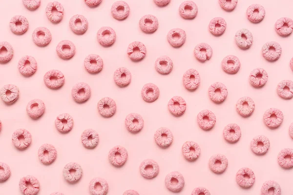 Many cereal rings on pink background