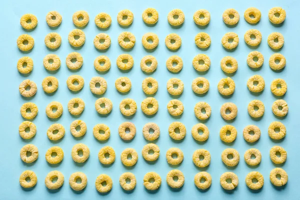 Many Yellow Cereal Rings Blue Background — Stock Photo, Image