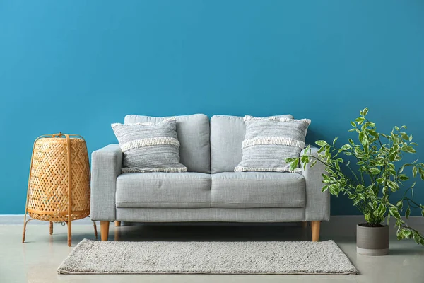 Stylish Decorative Pillows Cozy Grey Sofa Blue Wall — 图库照片