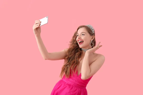Young Woman Tiara Bright Prom Dress Taking Selfie Pink Background — Foto de Stock