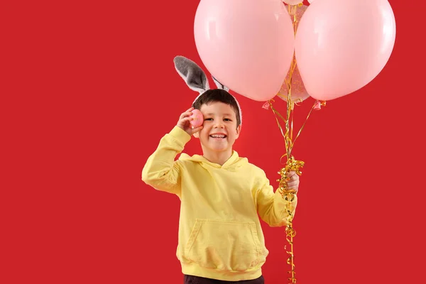 Cute Little Boy Bunny Ears Balloons Easter Egg Red Background — Stock Photo, Image
