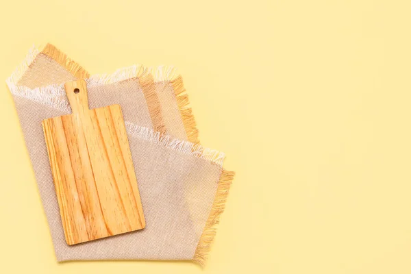 Wooden Cutting Board Napkin Yellow Background — Stock Photo, Image