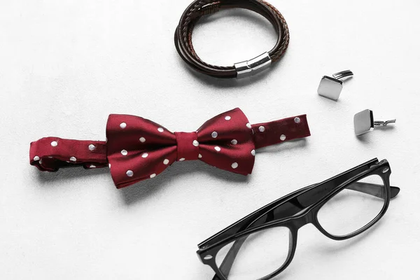 Stylish Male Bow Tie Eyeglasses Cufflinks Bracelet Light Background — Stock Photo, Image