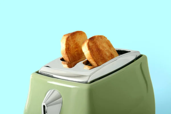 Modern Toaster Crispy Bread Slices Blue Background — Stockfoto