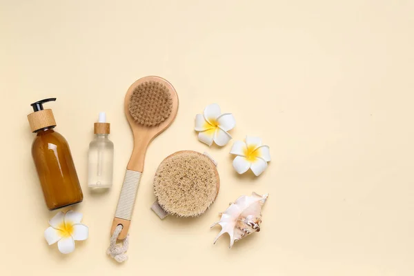 Composition Massage Brushes Bottles Cosmetic Products Flowers Color Background — Stock Photo, Image