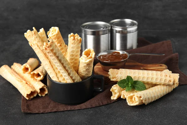 Cup Delicious Wafer Rolls Black Grunge Background — Stock Photo, Image