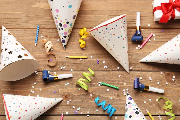 Composition with different party decor on wooden background