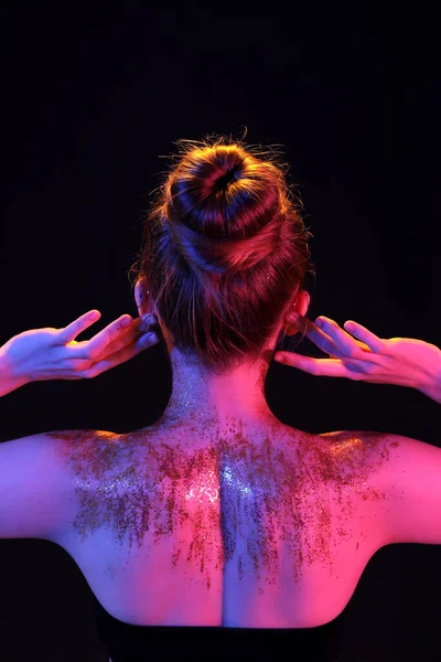 Young Woman Glitter Her Body Dark Background Back View — стоковое фото