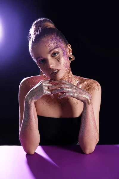 Beautiful Young Woman Glitter Makeup Purple Table Dark Background — Fotografia de Stock