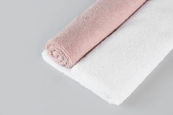 Cotton soft towels on grey background