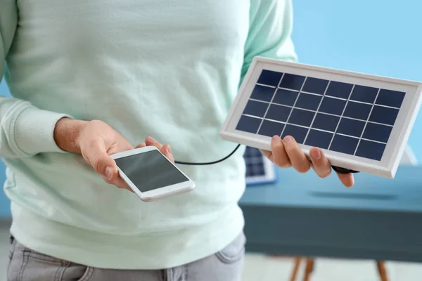 Handsome Man Charging Mobile Phone Portable Solar Panel Home Closeup — Stock Photo, Image