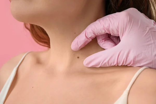 Dermatologist Examining Mole Young Woman Neck Pink Background Closeup — Stock Photo, Image
