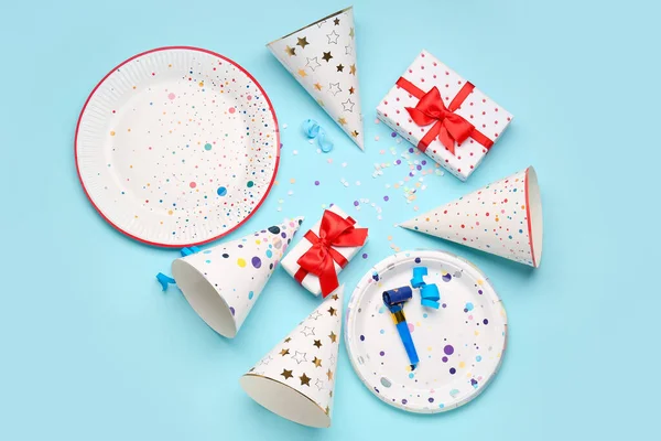 Composition with different party decor and gift boxes on color background