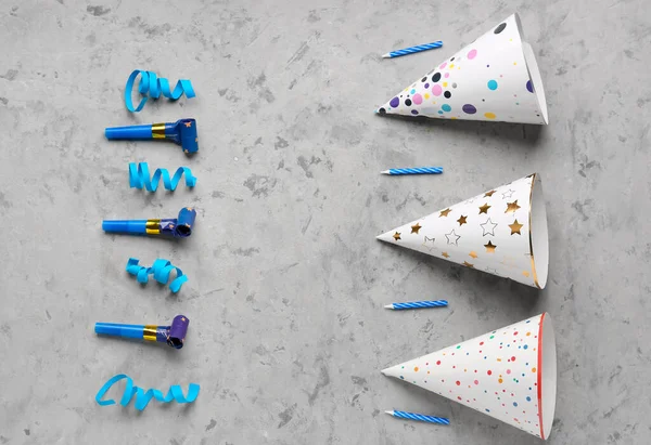 Composition Party Hats Whistles Birthday Candles Serpentine Grunge Background — Stockfoto