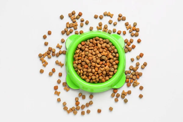 stock image Bowl of dry pet food isolated on white background