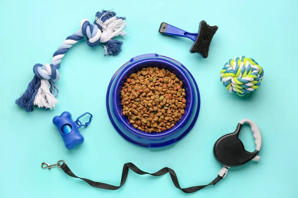 stock image Composition with dry food and pet care accessories on color background