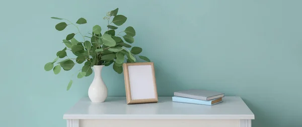 Vase Eucalyptus Branches Photo Frame Books Table Color Wall Room — Stock Photo, Image