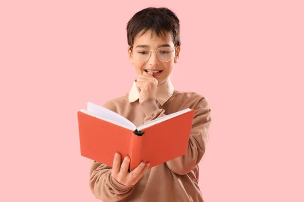 Little Boy Book Biting Nails Pink Background — Stockfoto