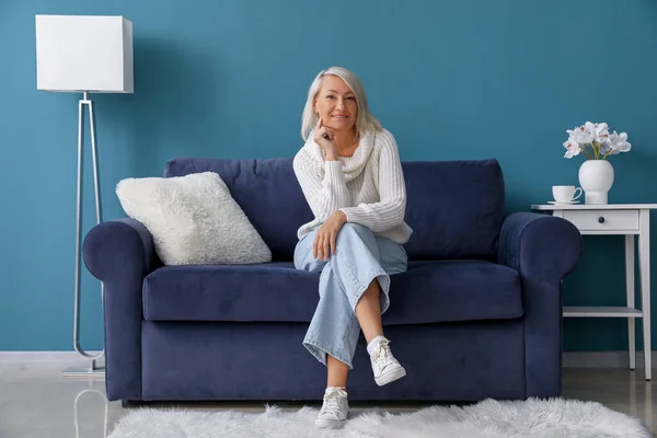 Mature Woman Sitting Blue Sofa Home — Stock Photo, Image