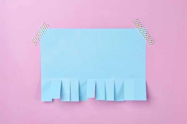 stock image Blank paper tear-off ad on pink background