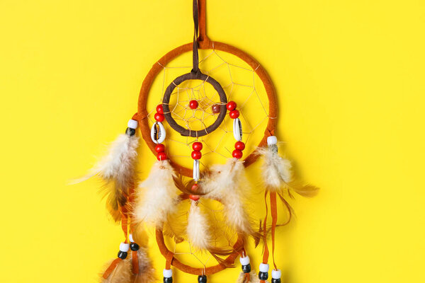 Beautiful dreamcatchers on yellow background