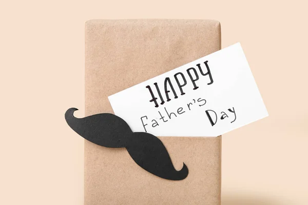 Gift for Father\'s Day celebration on color background, closeup