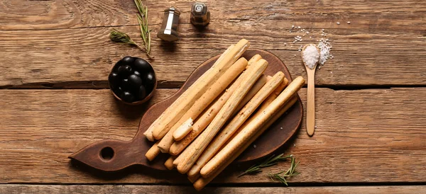Board Tasty Italian Grissini Olives Salt Wooden Background — Stock Photo, Image