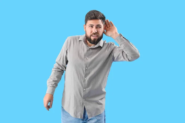 Young Man Suffering Loud Noise Blue Background — Photo