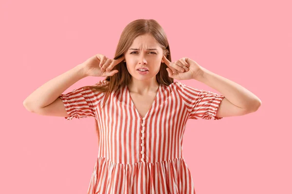 Young Woman Suffering Loud Noise Pink Background — Stock fotografie