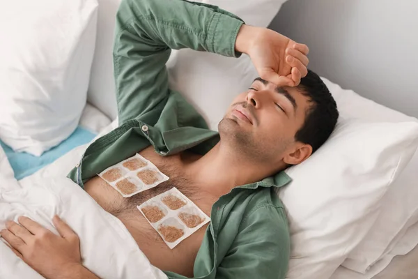 Ill Young Man Mustard Plasters His Chest Lying Bedroom — Stock Photo, Image