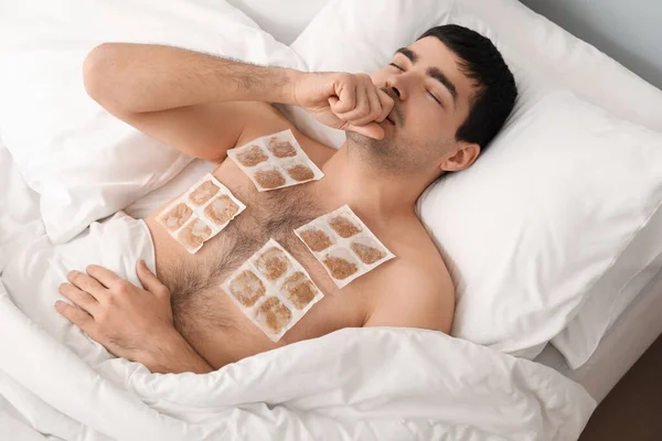Ill Young Man Mustard Plasters His Chest Lying Bedroom — Stock Photo, Image