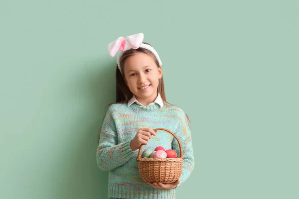 Little Girl Bunny Ears Basket Easter Eggs Green Background — Fotografia de Stock