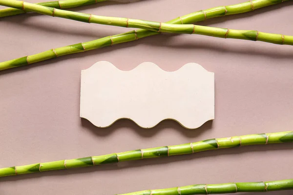Green Bamboo Stems Plaster Podium Beige Background — Stock Photo, Image