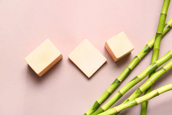 stock image Bamboo stems and plaster podiums on beige background