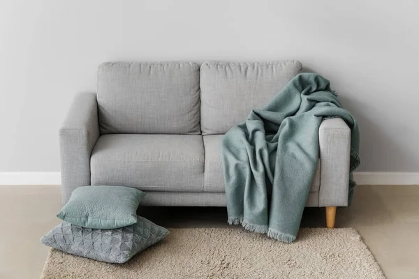 Cozy Sofa Cushions Plaid Grey Wall — Stock Photo, Image