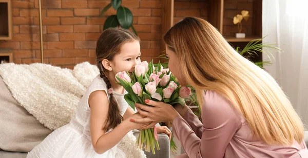 Cute Little Girl Greeting Her Mother Tulips Home — Stock Photo, Image