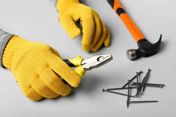 Male Hands Gloves Holding Pliers White Background — Stock Photo, Image