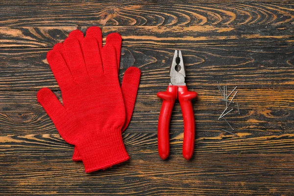 Pliers Gloves Nails Wooden Background — Stock Photo, Image