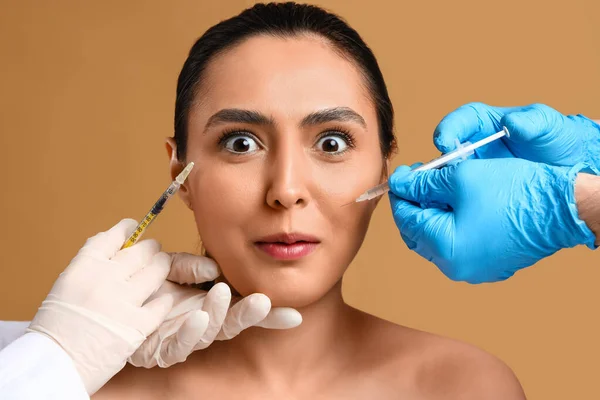 Young Woman Receiving Filler Injections Face Beige Background — Stock Photo, Image