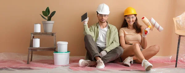 stock image Happy young couple resting after making repair in their new house