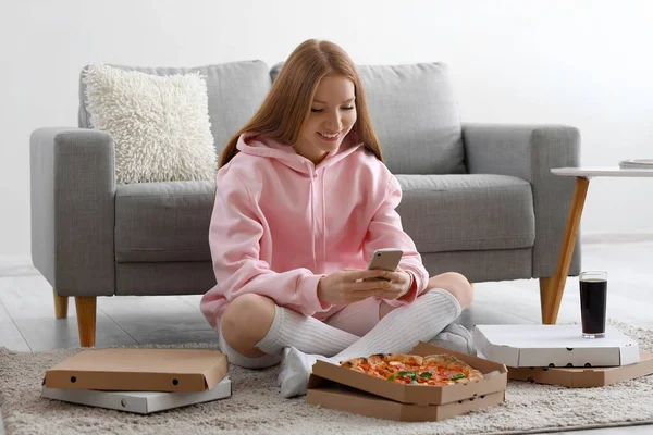 Young Woman Tasty Pizza Using Mobile Phone Home — Stock Photo, Image