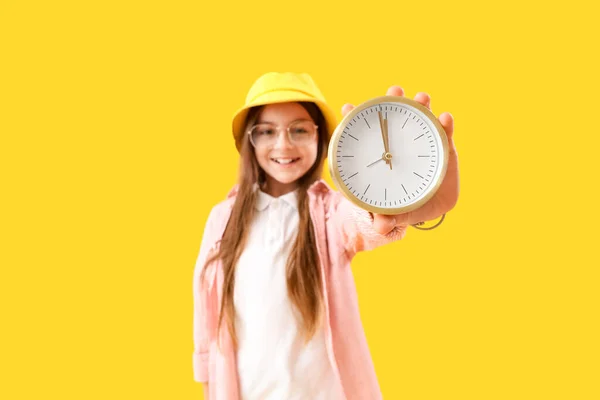Little Girl Alarm Clock Yellow Background Closeup — Zdjęcie stockowe