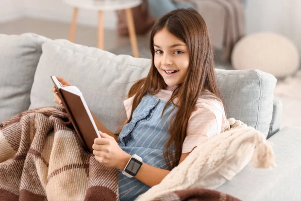 Little Girl Smartwatch Reading Book Home — Stock Photo, Image